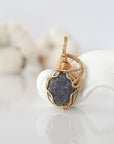 Detailed front view of raw sapphire pendant in 14k gold filled. Unique wire wrapped September birthstone jewelry by Designs by Nature Gems.