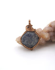 Front view of a raw sapphire pendant wire wrapped in antique bronze — natural crystal necklace handcrafted in Toronto