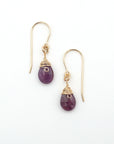 Detailed front view of ruby drop earrings, genuine faceted ruby with minimalist 14k gold filled wire wrapping, Designs by Nature Gems