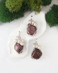 Three silver wire wrapped ruby and freshwater pearl pendants showing natural stone variation, artisan jewelry for women