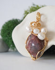 Side angle detail of ruby and freshwater pearl pendant, gold wire wrapped, ethical artisan necklace