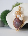 Side angle detail of ruby and freshwater pearl pendant, gold wire wrapped, ethical artisan necklace