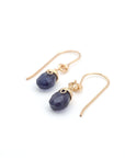 Angled look at sapphire drop earrings, artisan wire wrapping in 14k gold filled, September birthstone
