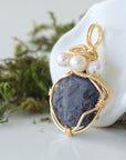Side angle detail of sapphire and freshwater pearl pendant, gold wire wrapped, ethical artisan necklace