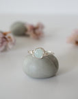 Detailed front view of minimalist silver aquamarine ring, natural 6mm aquamarine bead