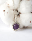 Detailed front view of women’s amethyst necklace, 8mm amethyst bead, artisan wire wrapped in silver plated copper