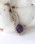 Right side angle of women’s amethyst necklace, 8mm amethyst bead, artisan silver plated copper wire wrap