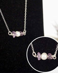 Close-up of raw amethyst stones and freshwater pearl bar on 925 sterling silver necklace