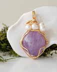 Detailed front angle of amethyst and freshwater pearl pendant, gold wire wrapped, handcrafted gemstone jewelry