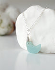 Left side angle of aquamarine moon necklace for women, detailed wire wrapping, sterling silver