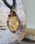 Side angle of mens citrine pendant showing crystal dimension and wire wrapping - natural stone in antique bronze copper handmade masculine necklace profile view