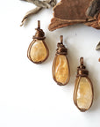 Three natural citrine crystals showing variation in color size and shape - pale yellow to golden amber unique wire wrapped antique bronze pendants unisex one of a kind