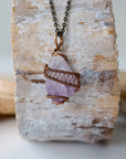 Front view of raw amethyst point necklace with detailed antique bronze copper wire wrap on antique bronze chain