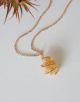 Raw citrine necklace laying flat in gold plated copper - handmade wire wrapped natural unpolished crystal pendant with chain full view November birthstone jewelry