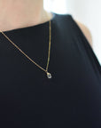 Woman wearing small delicate citrine necklace 14k gold filled minimalist crystal pendant jewelry