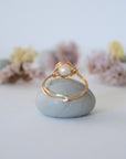 Back view of a minimalist pearl ring crafted in 14k gold filled wire