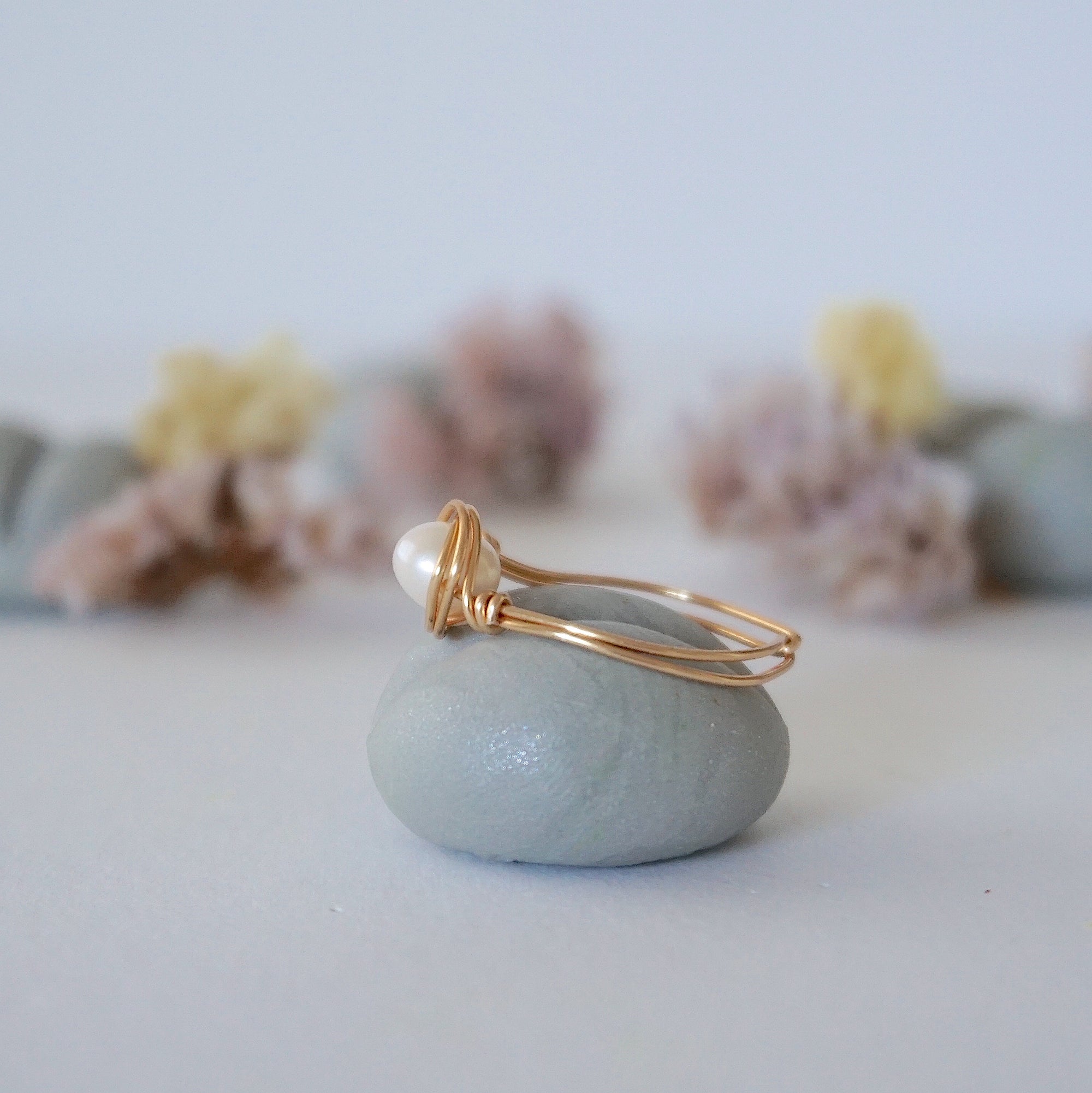 Side view of a 14k gold filled pearl wire wrapped ring