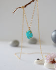 Side angle view of 14k gold vermeil turquoise necklace showing stone depth profile