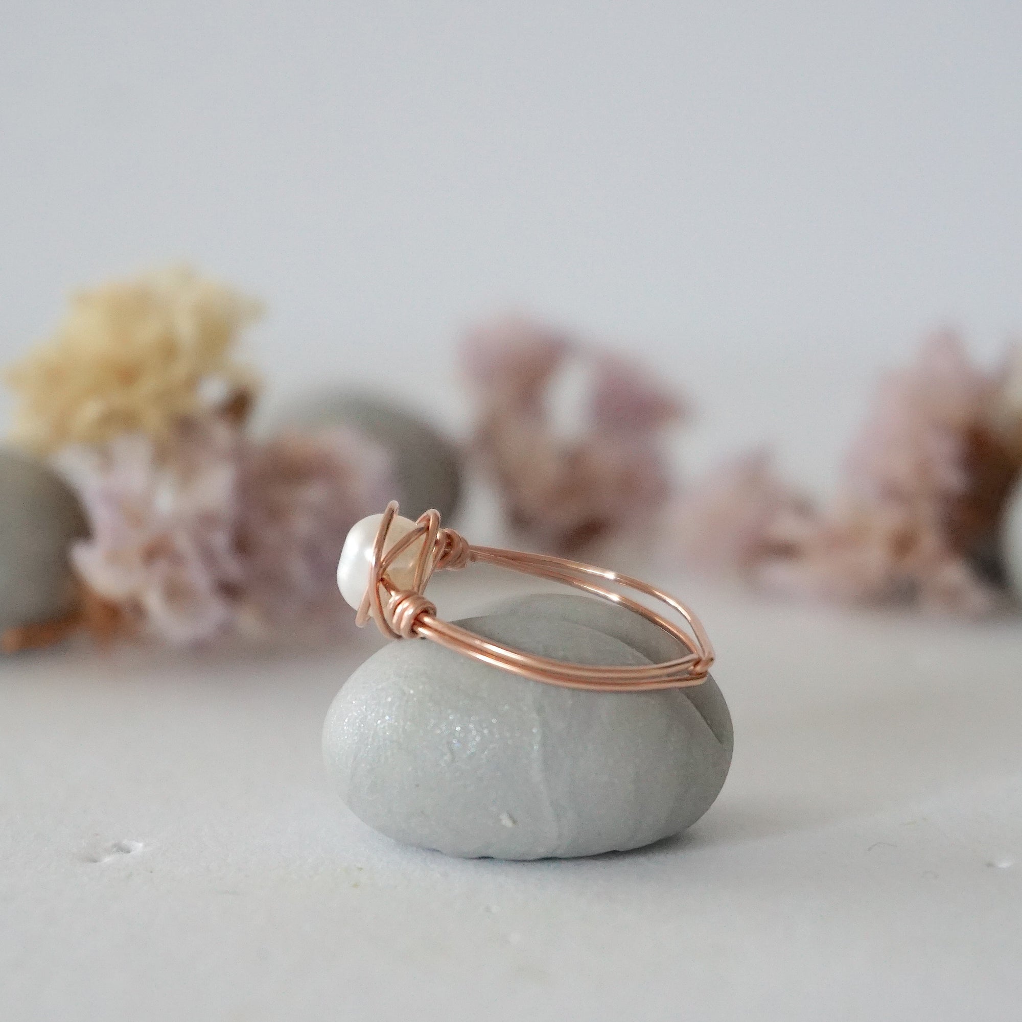 Side view of a 14k rose gold filled pearl wire wrapped ring