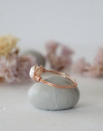Side view of a 14k rose gold filled pearl wire wrapped ring