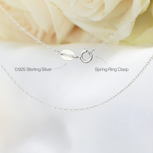 Close-up of 925 sterling silver fine cable chain with 925 stamp and spring clasp closure for ruby and pearl bar necklace.