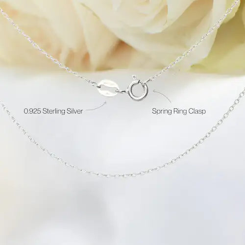 Close-up of 925 sterling silver fine cable chain with 925 stamp and spring clasp closure for ruby and pearl bar necklace.