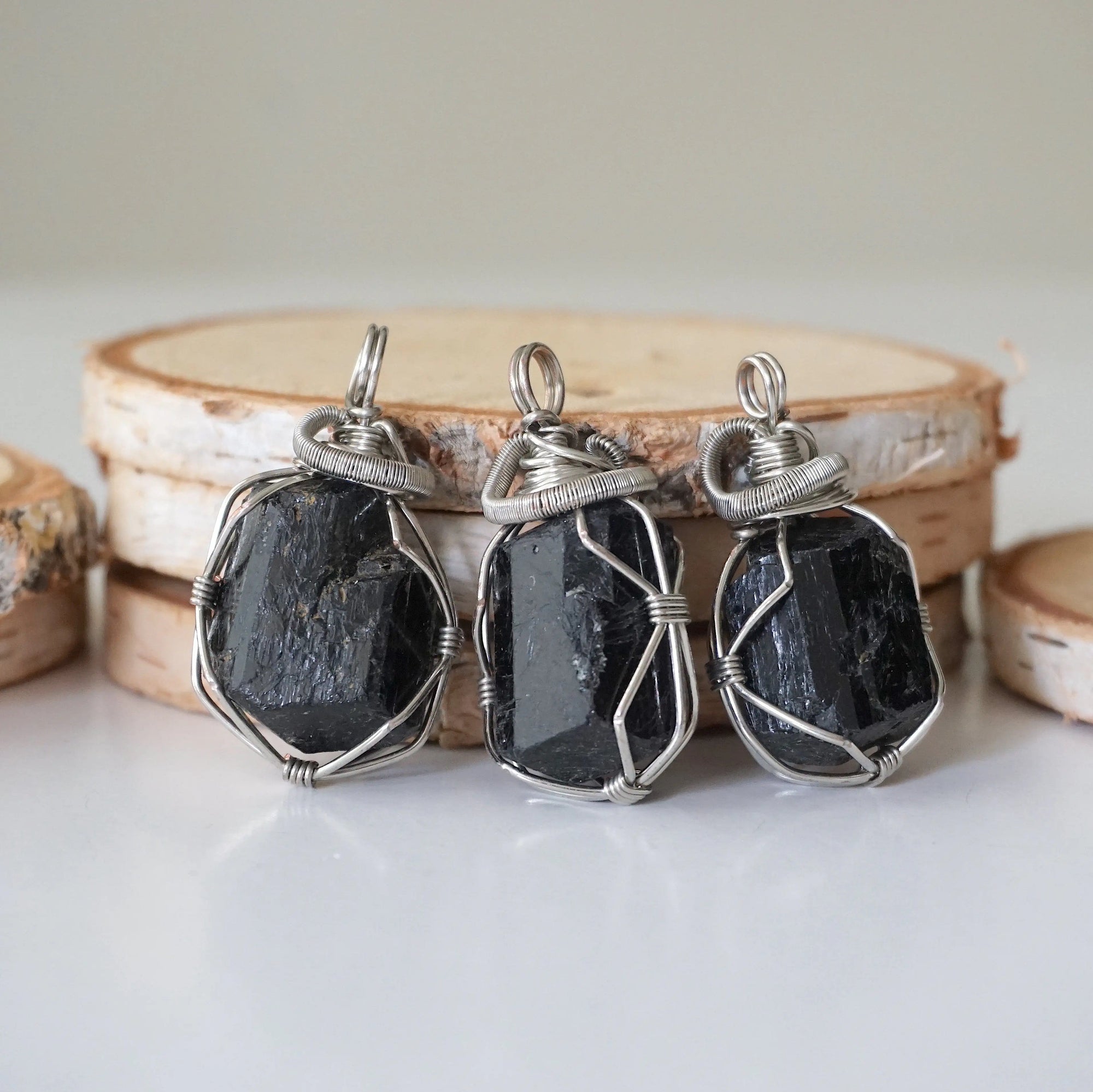 Three raw black tourmaline necklaces for men – shows natural variation in size, shape, and black color of tourmaline stones.