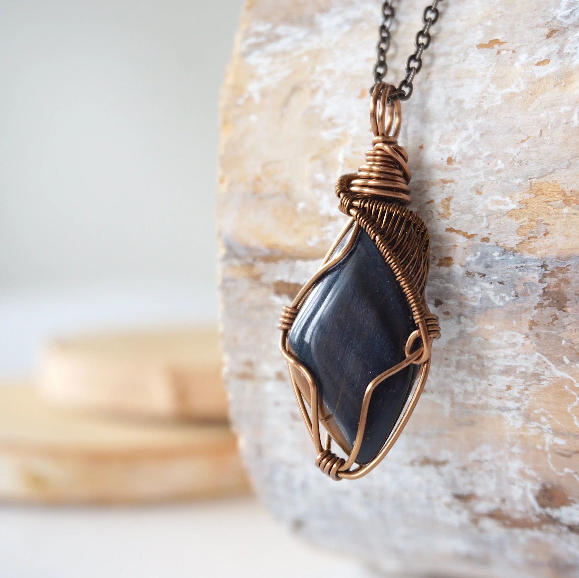 Left angle close-up of blue tiger's eye necklace for men – highlighting unique wire-wrapped artistry, blue tiger's eye, antique bronze copper.
