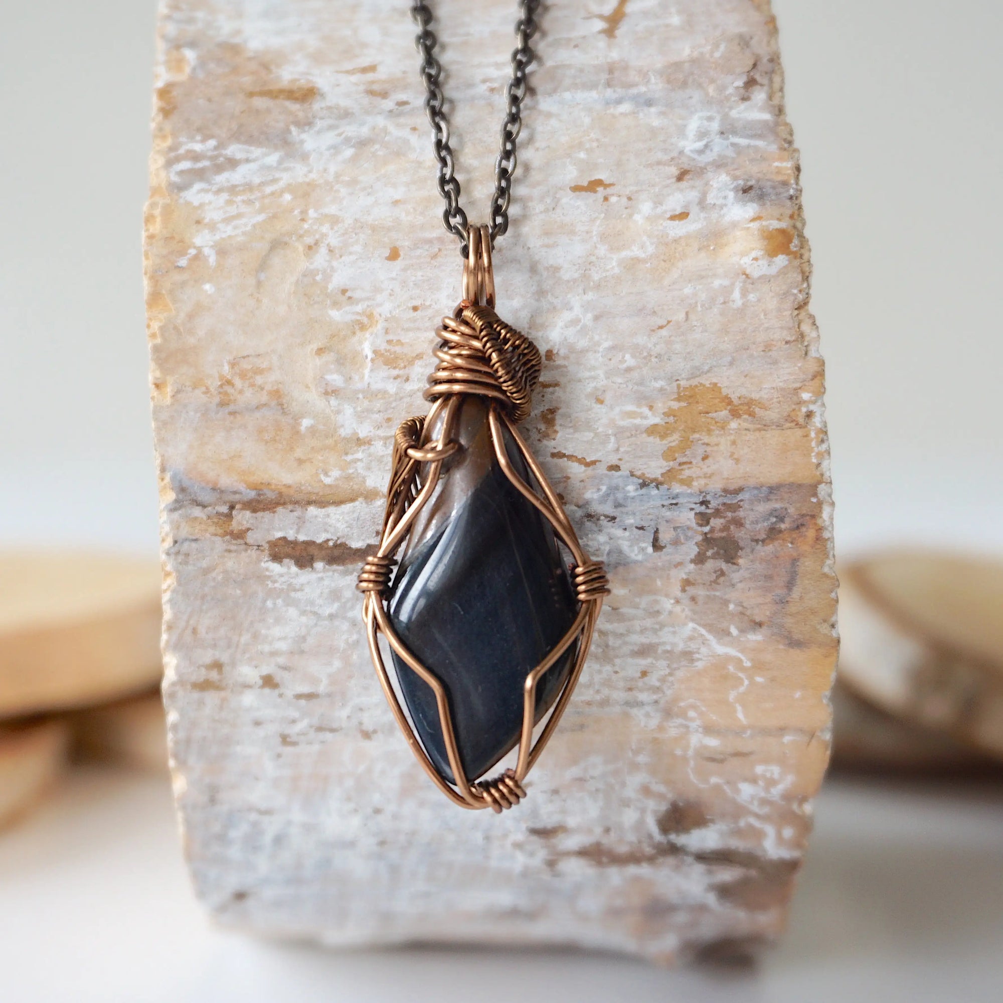 Back view of handcrafted blue tiger's eye necklace for men – natural stone and wire wrapping, antique bronze copper, masculine design.