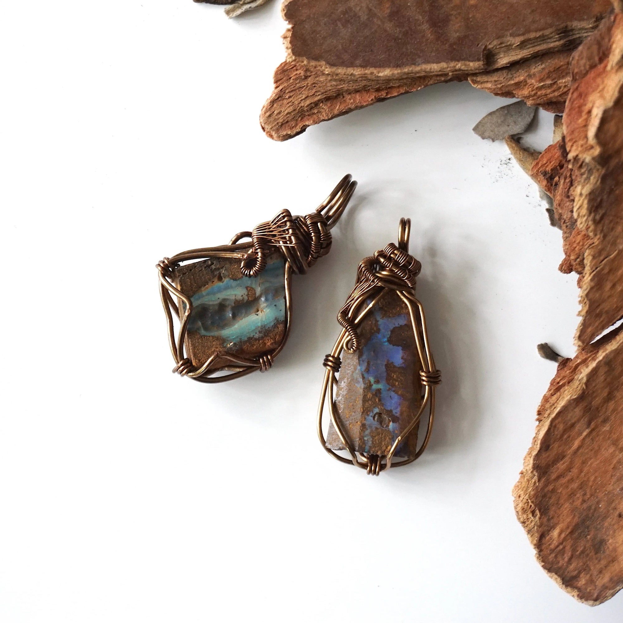 Two Australian boulder opal pendants for men – shows natural variation in size, shape, and color of opal stones.