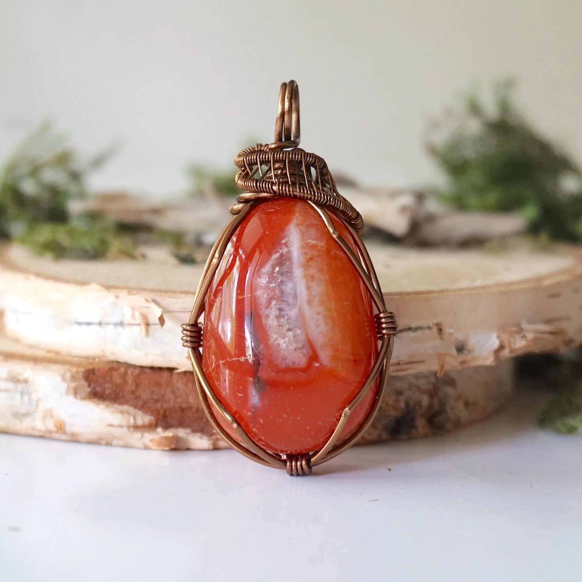 Front angle close-up of carnelian necklace – detailed artisan wire wrapping, natural raw carnelian, handcrafted Virgo birthstone pendant.