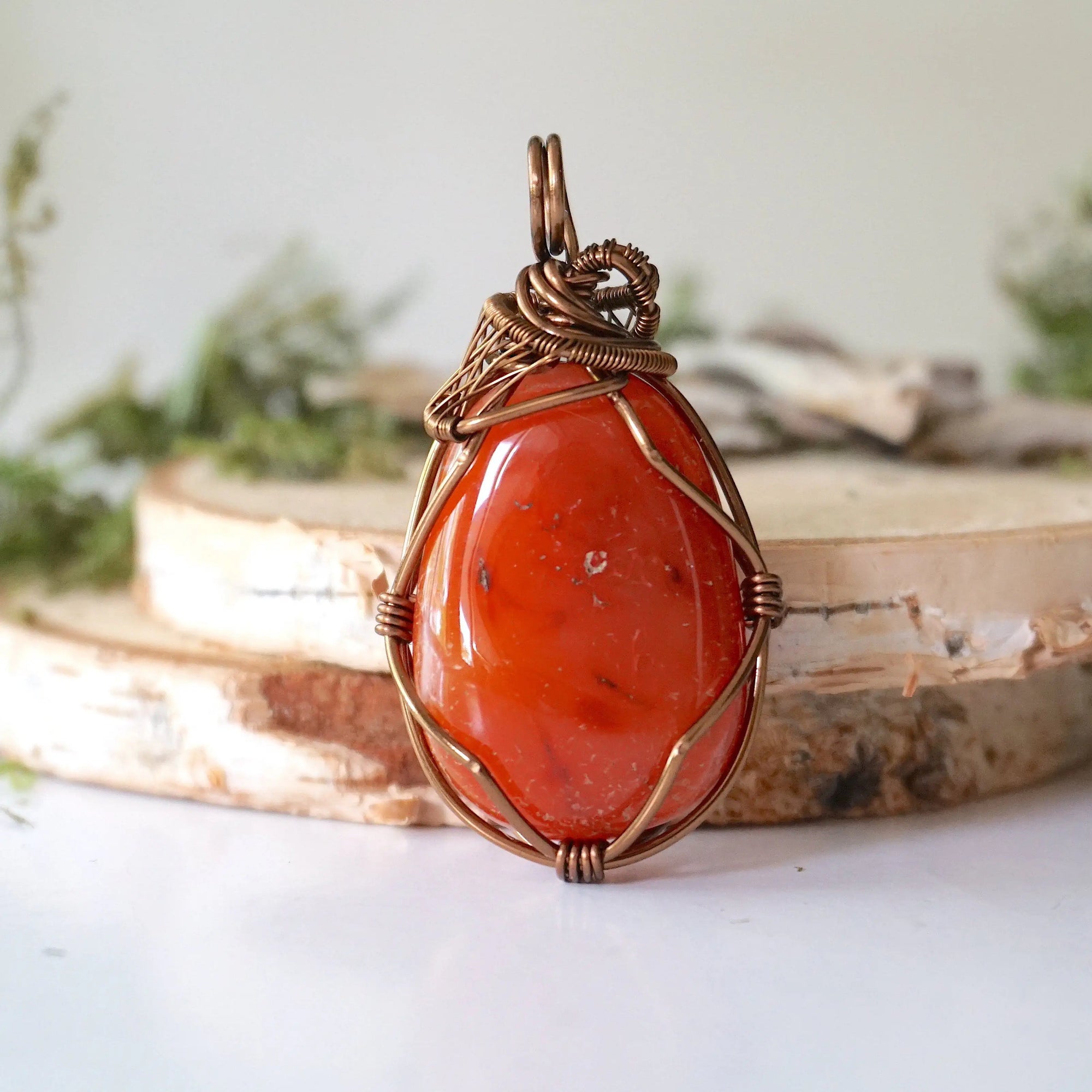 Back view of handcrafted carnelian necklace – natural stone and wire wrapping detail, Virgo birthstone pendant, Designs by Nature Gems.