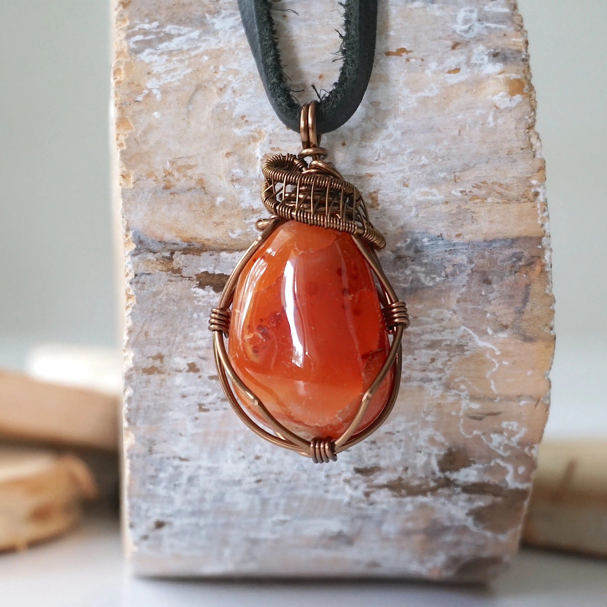 Handcrafted raw carnelian necklace for men, front view – artisan bronze copper wire wrapping, Virgo birthstone, black leather cord.
