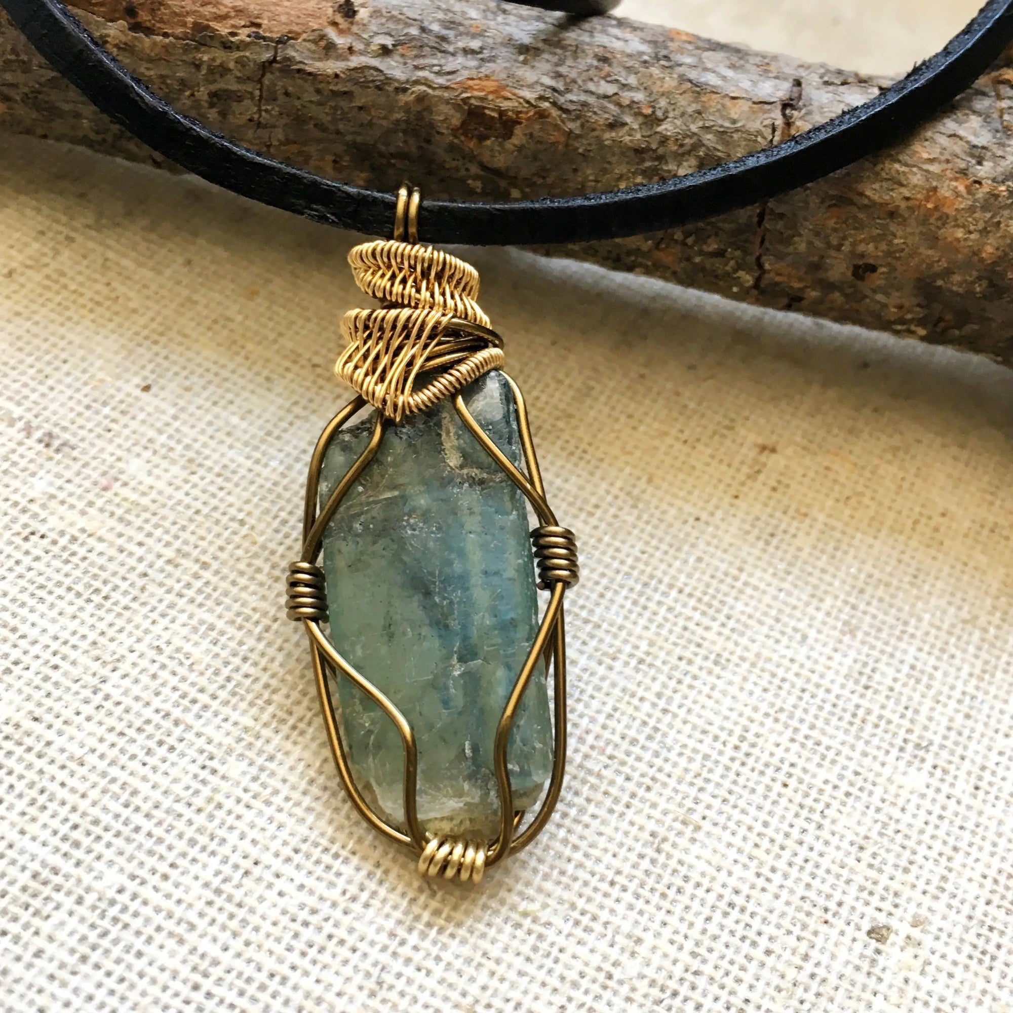 Back view of handcrafted green kyanite necklace for men – natural stone and wire wrapping, alternative May birthstone, antique bronze and gold copper.