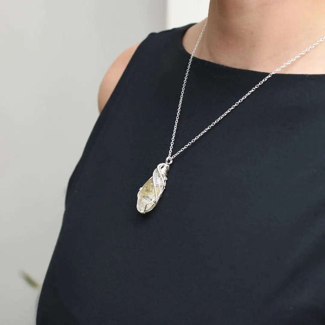 Woman wearing wire wrapped citrine necklace November birthstone pendant sterling silver jewelry

