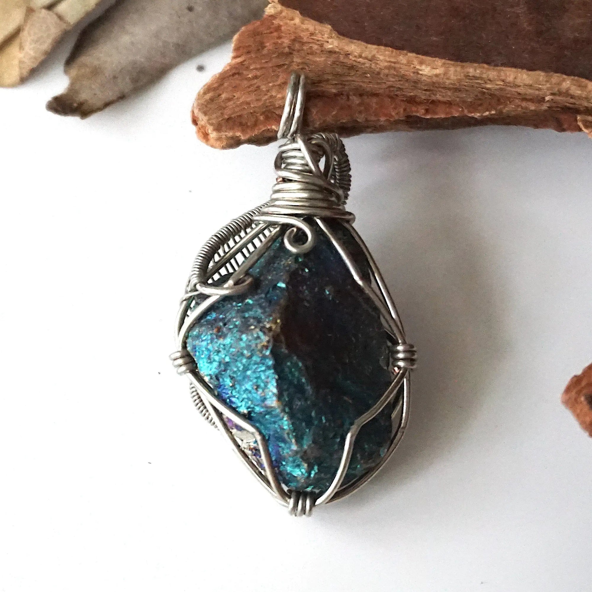 Back view of handcrafted peacock ore pendant for men – natural stone and detailed wire wrapping, Capricorn and Cancer birthstone.