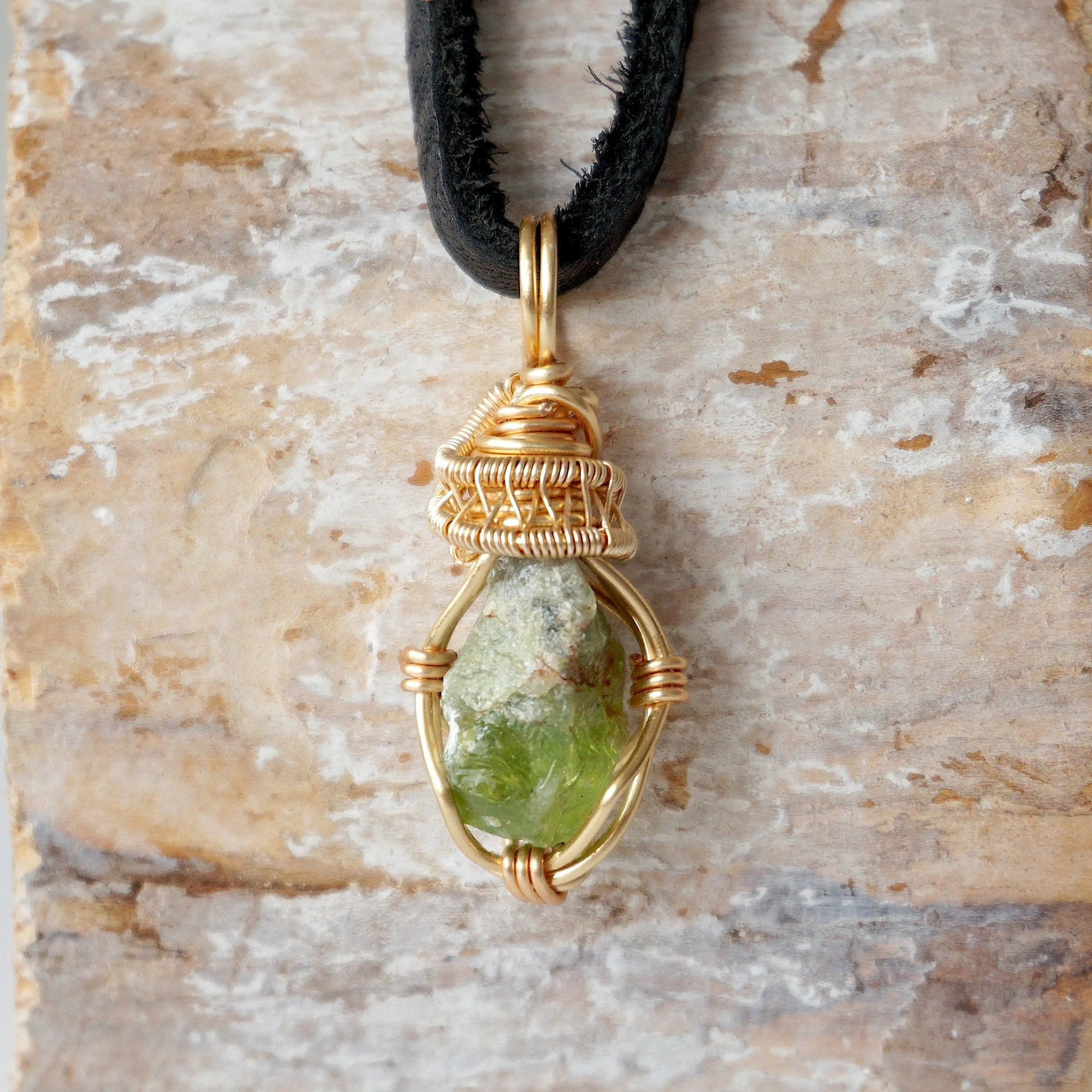 Handcrafted raw peridot necklace for men, front view – artisan warm gold copper wire wrapping, natural August birthstone pendant.