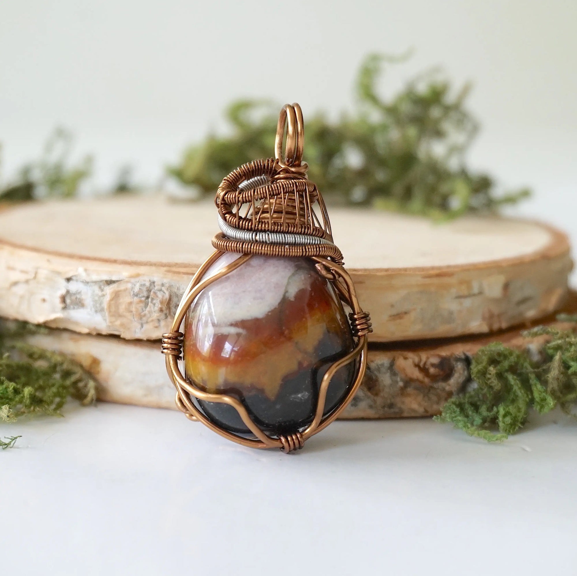 Front angle close-up of sardonyx necklace – detailed artisan wire wrapping, natural banded sardonyx, handcrafted August birthstone pendant.