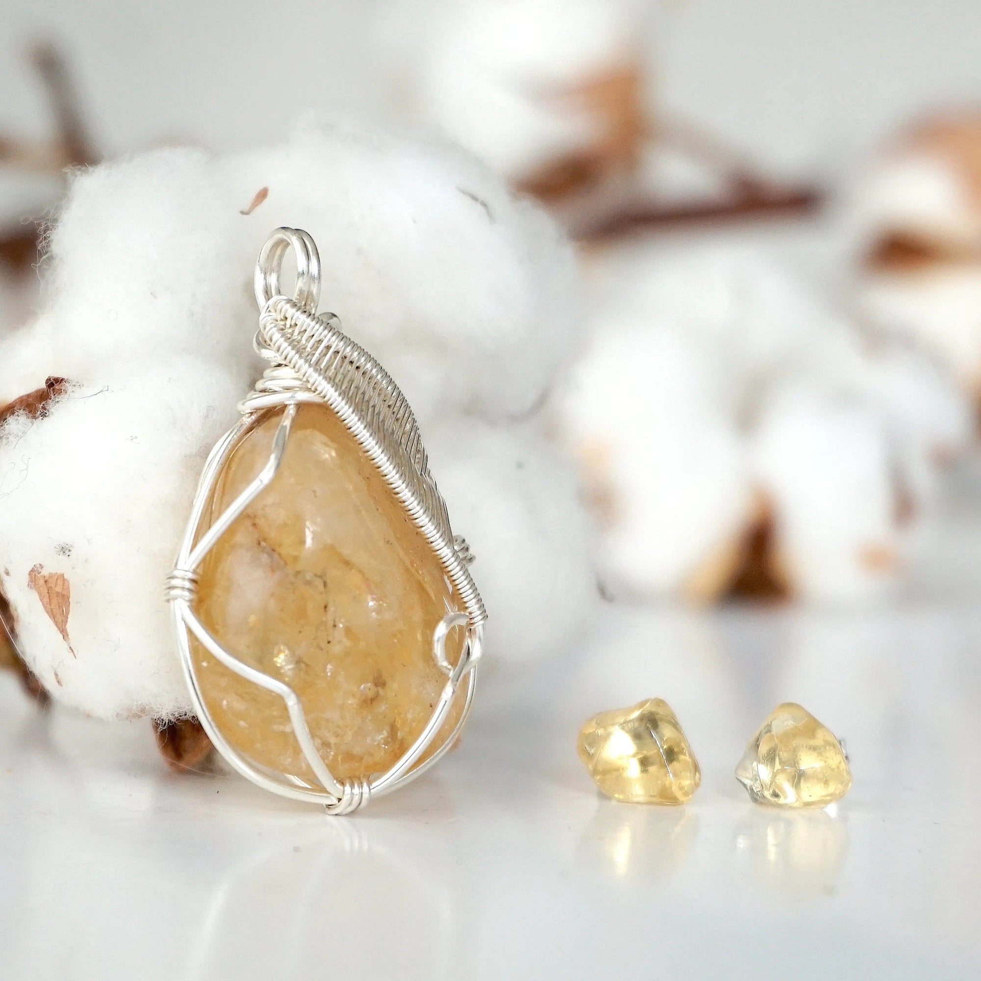Side view of raw citrine necklace and earrings set showing wire wrapping detail and natural stone texture
