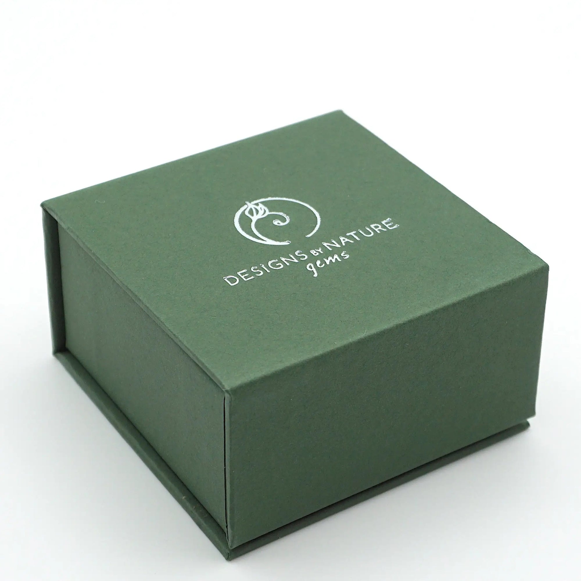 Green jewelry box with 'Designs of Nature' logo on a white background