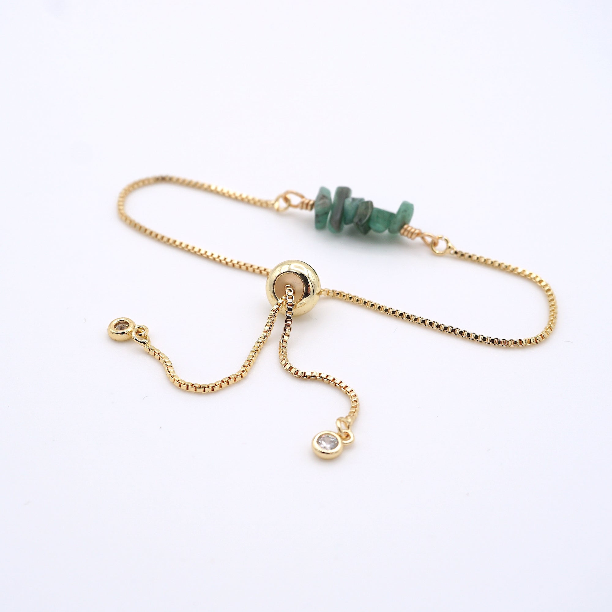 Gold plated brass slider closure on adjustable emerald bracelet showing easy fit mechanism - handcrafted birthstone jewelry