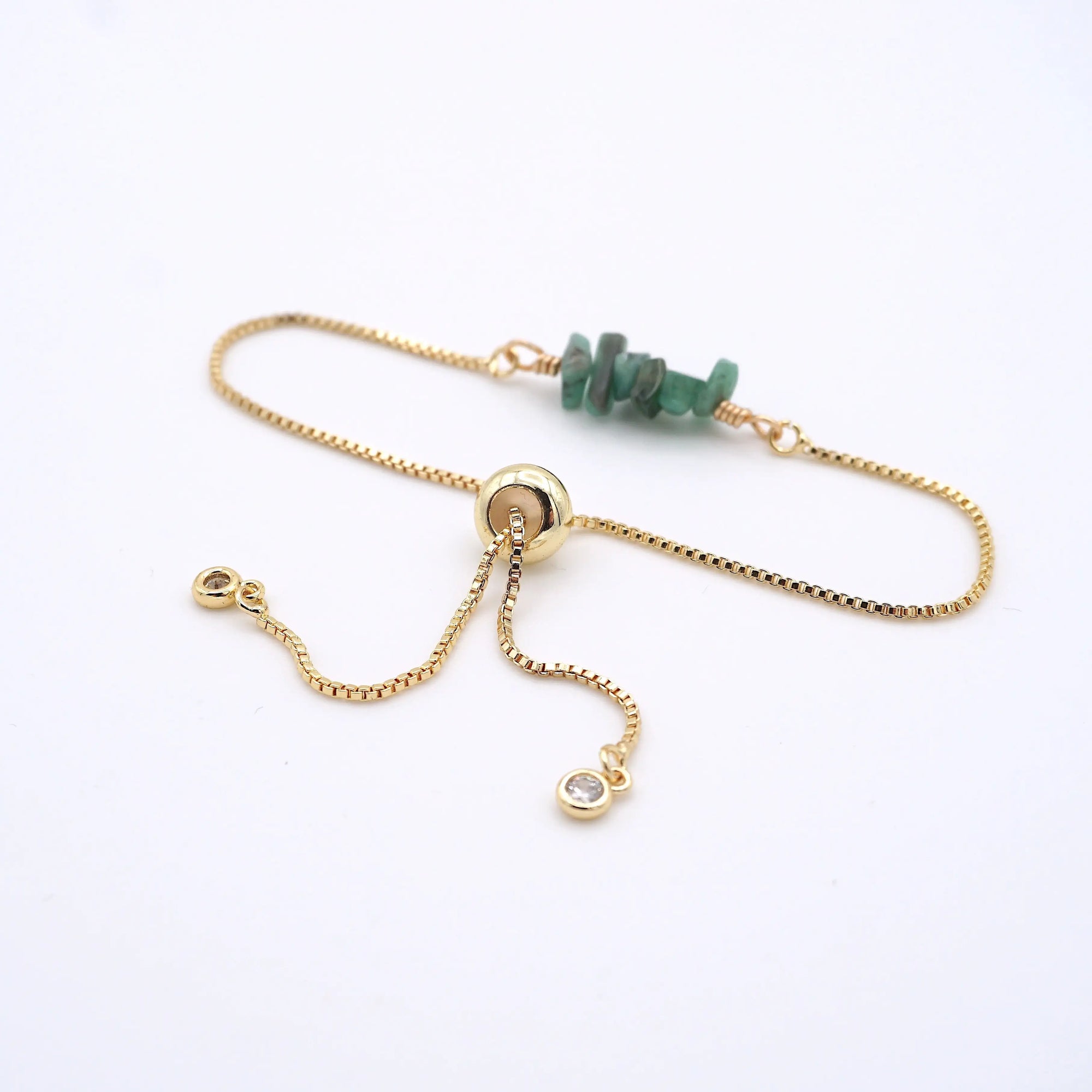 Gold plated brass slider closure on adjustable emerald bracelet showing easy fit mechanism - handcrafted birthstone jewelry