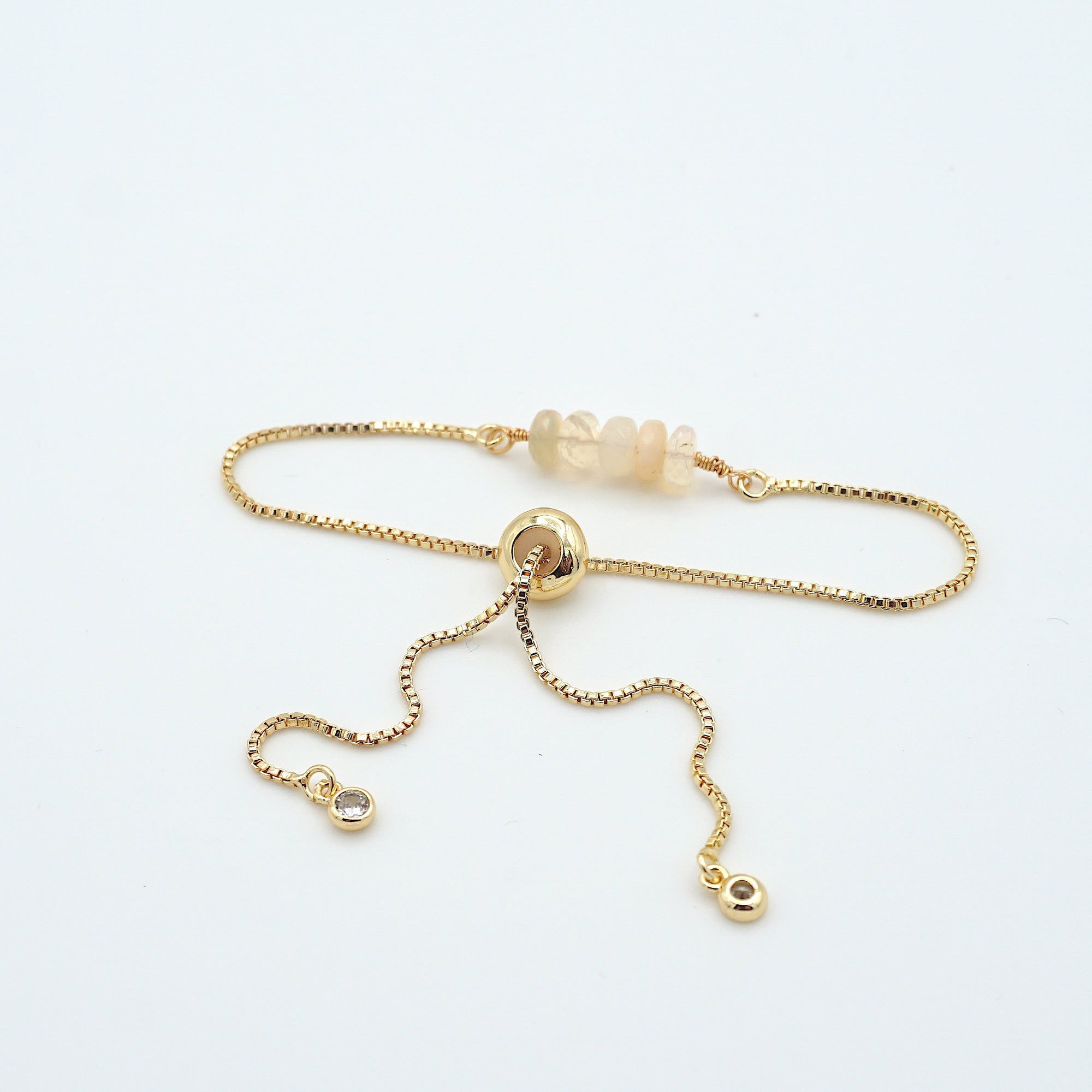 Gold plated brass slider closure on adjustable opal bracelet showing easy fit mechanism - handcrafted birthstone jewelry
