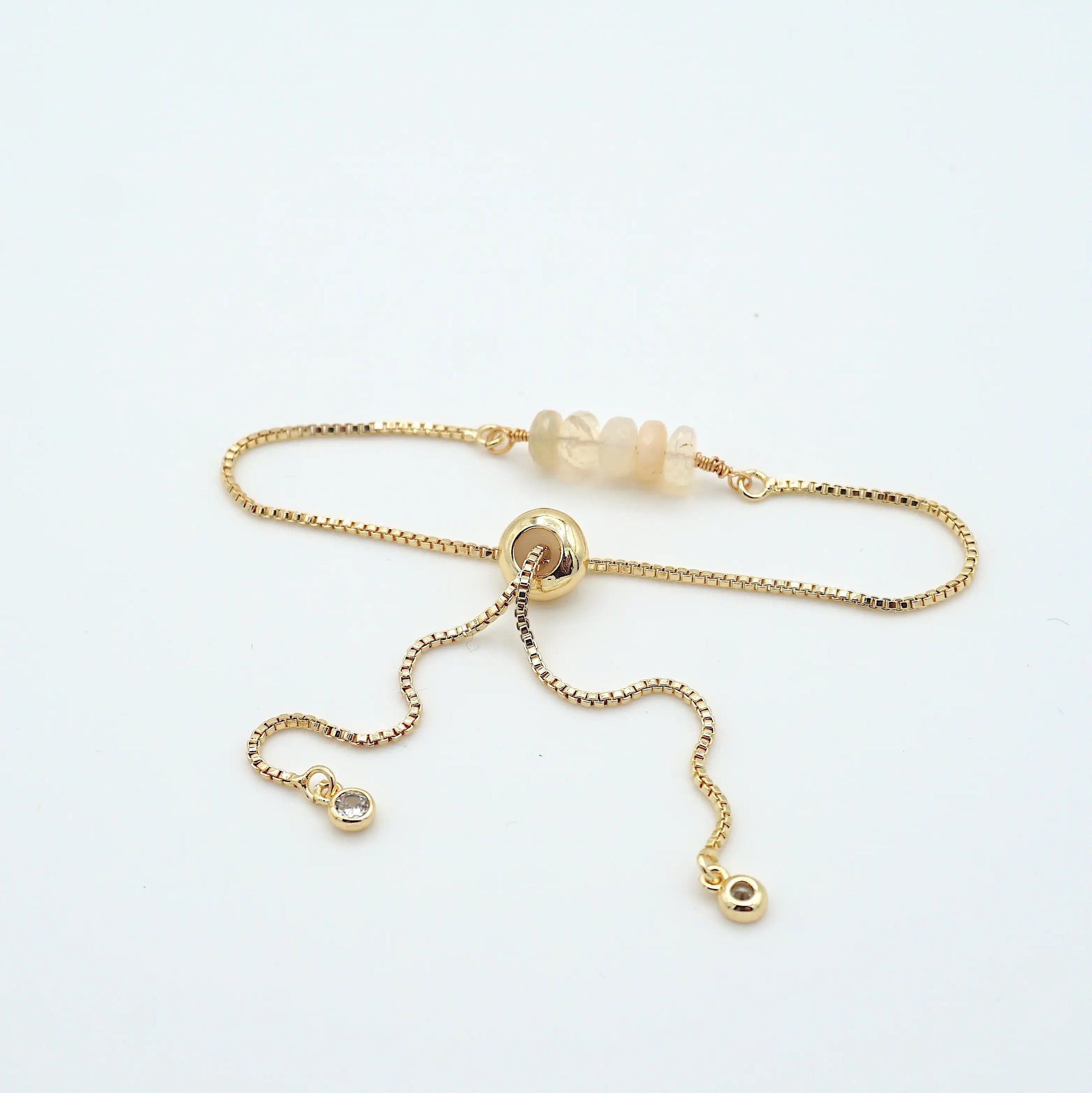 Gold plated brass slider closure on adjustable opal bracelet showing easy fit mechanism - handcrafted birthstone jewelry
