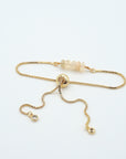 Gold plated brass slider closure on adjustable opal bracelet showing easy fit mechanism - handcrafted birthstone jewelry
