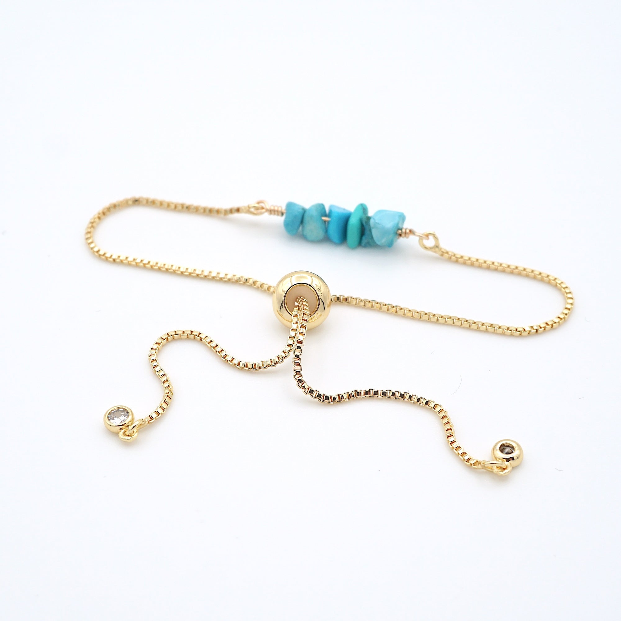 Gold plated brass slider closure on adjustable turquoise bracelet showing easy fit mechanism - handcrafted birthstone jewelry