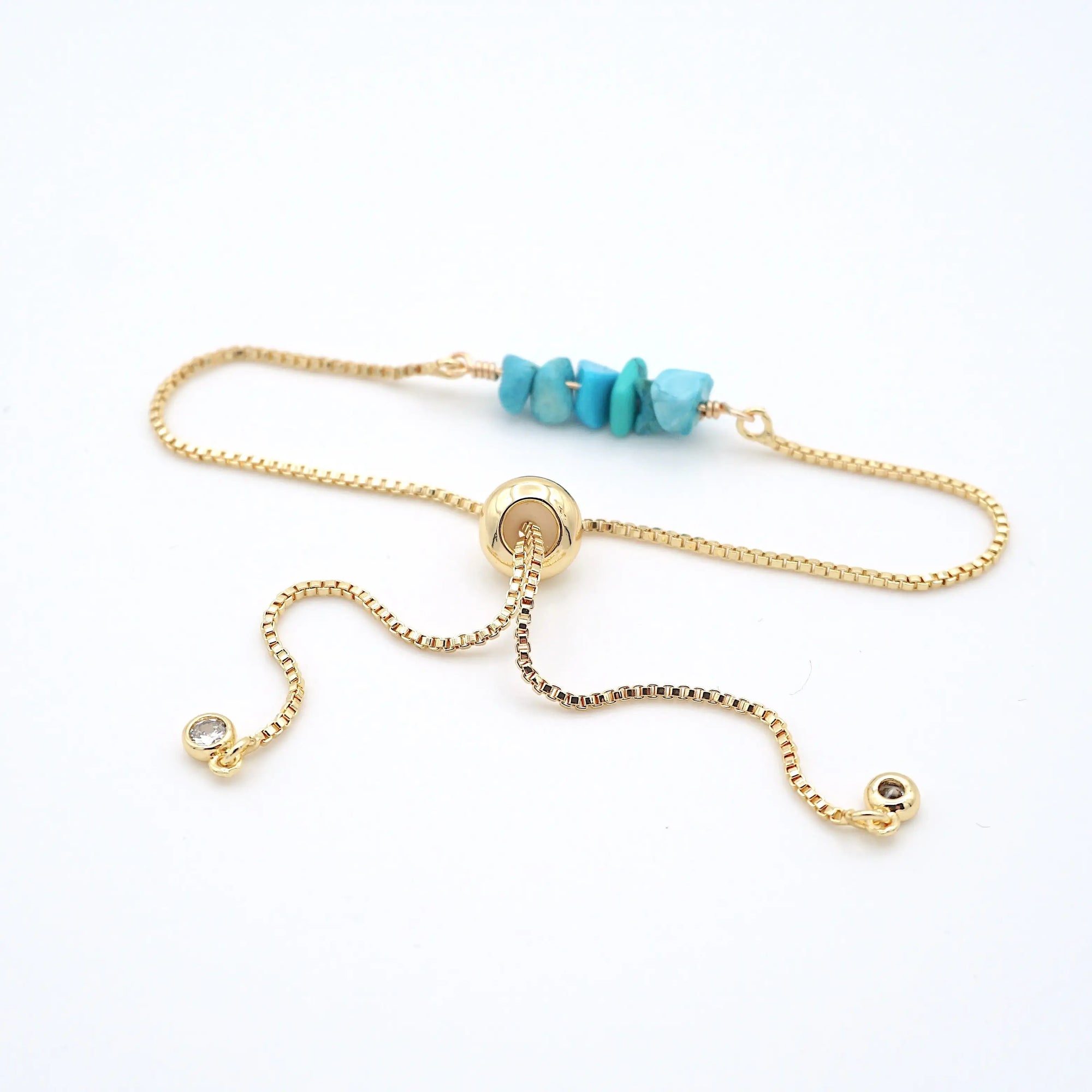 Gold plated brass slider closure on adjustable turquoise bracelet showing easy fit mechanism - handcrafted birthstone jewelry