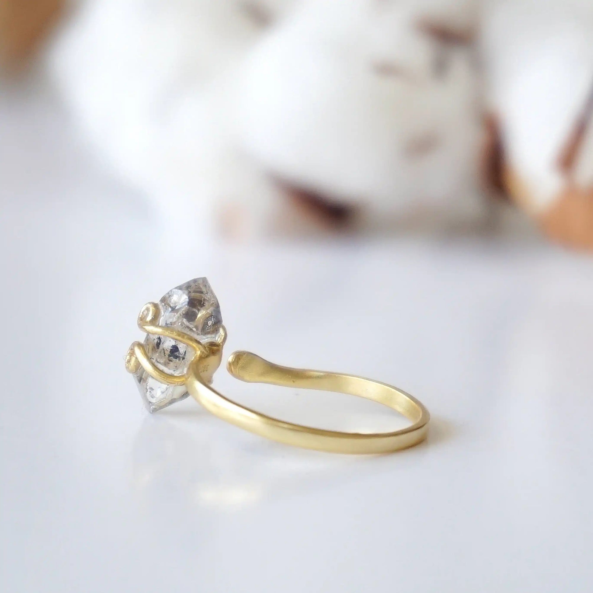 Back view of adjustable raw Herkimer diamond ring showing the ring band and handcrafted gold vermeil setting.