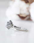 Back view of adjustable raw Herkimer diamond ring showing the ring band and handcrafted sterling silver setting.