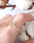 Adjustable raw Herkimer diamond ring in 14k gold vermeil worn on a female model’s hand.